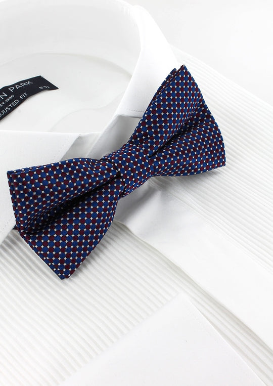 Noeud papillon bleu motifs géométriques bordeaux