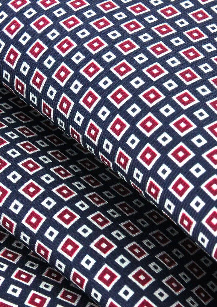Pochette de costume en soie bleu marine à motifs bordeaux et blanc