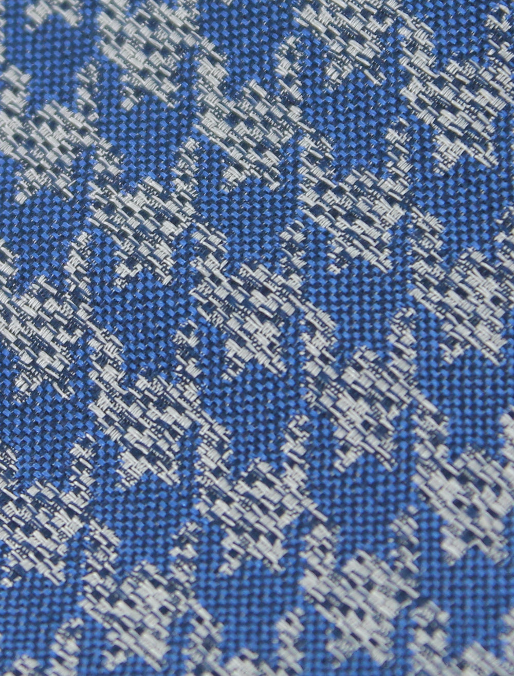 Blue tie with gray patterns